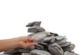 WomanÃ¢â¬â¢s hand adding a rock to a cairn